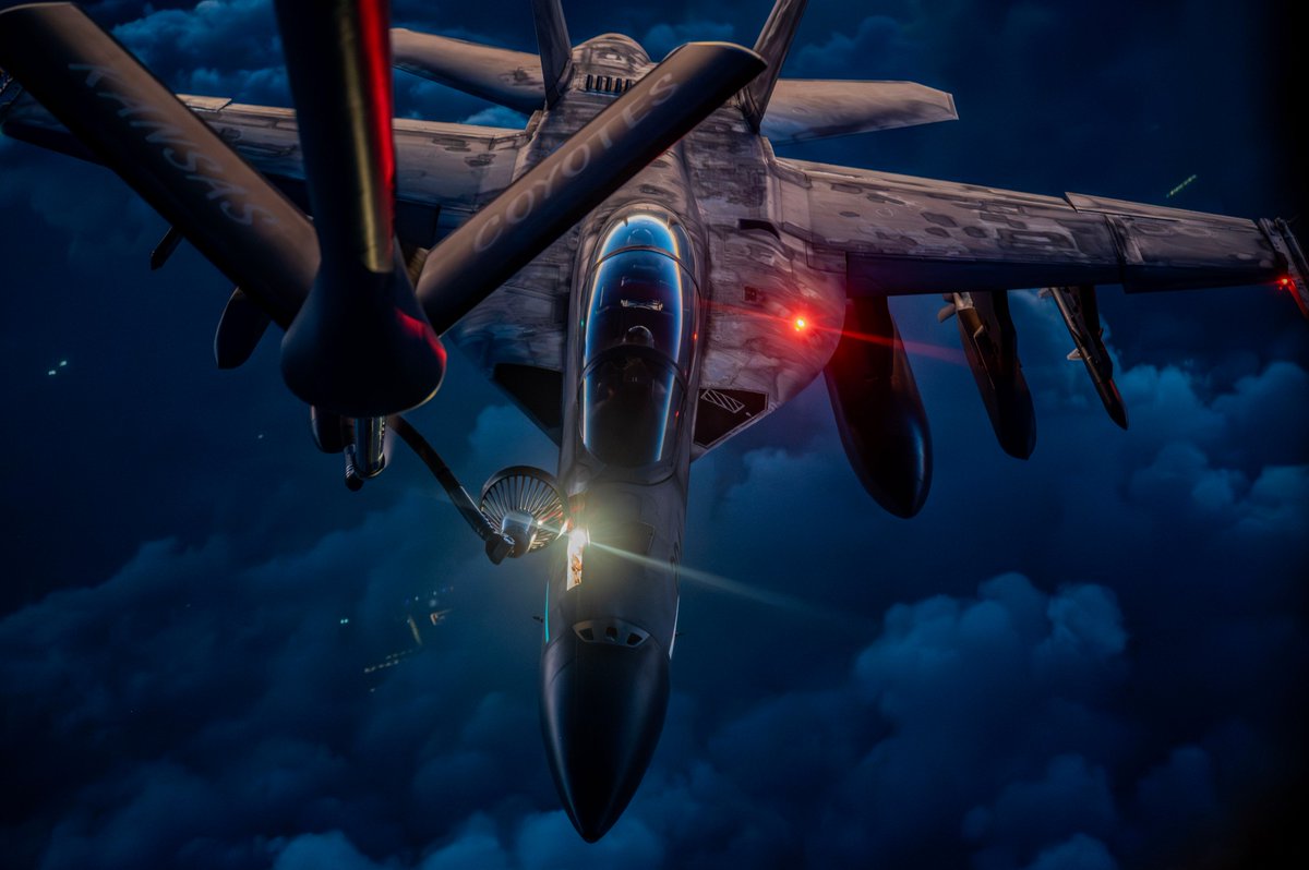 A U.S. Air Force KC-135 Stratotanker refuels a U.S. Navy F/A-18F Super Hornet over the middle east during Operation Epic Fury.