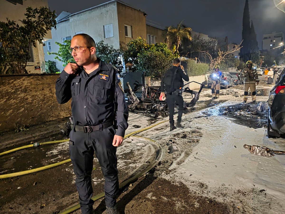 The IDF says it is investigating the circumstances of the impacts in central Israel this evening after Iran launched a ballistic missile with a cluster bomb warhead.
Suspected missile fragments or cluster munitions sparked a fire on the roof of a building in Shoham, caused damage to a highway, and damaged cars in Rishon Lezion, according to rescue services.