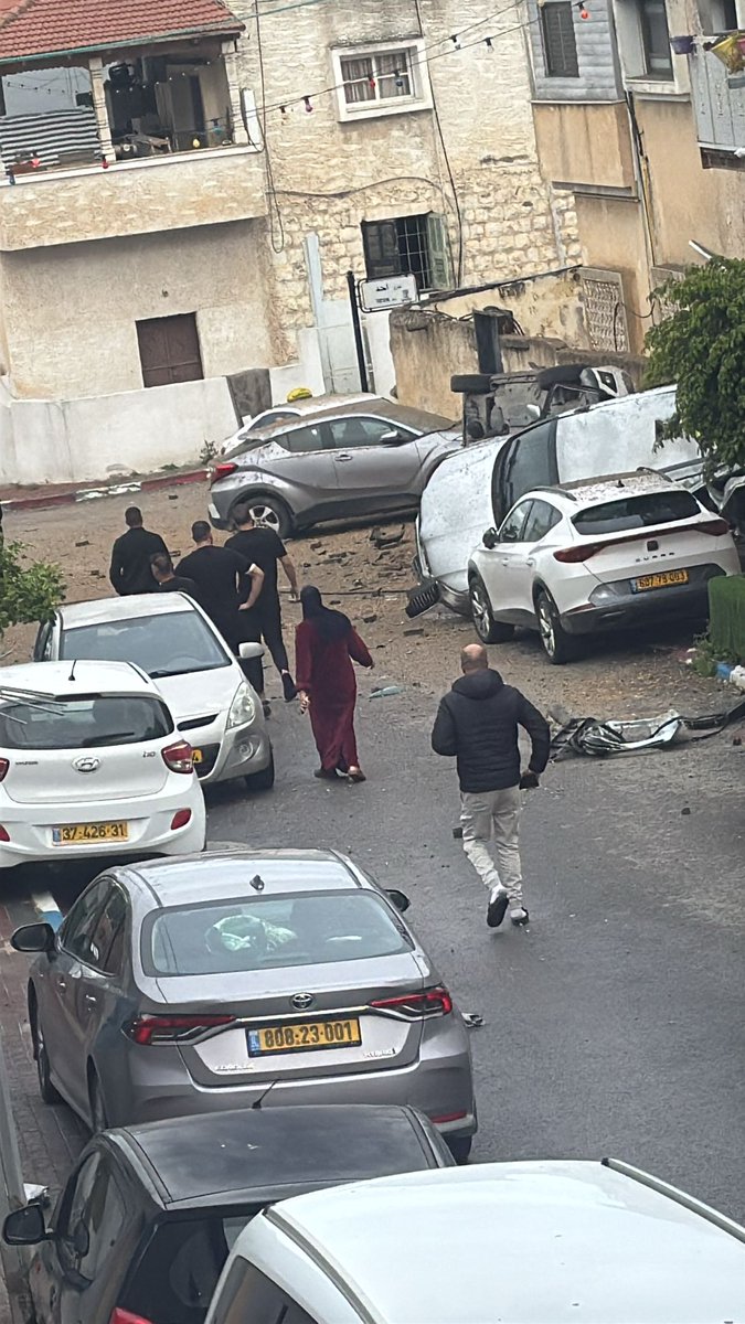 Damage was caused in the central city of Kfar Qasim by apparent submunitions from a cluster bomb warhead, following Iran's latest ballistic missile attack.