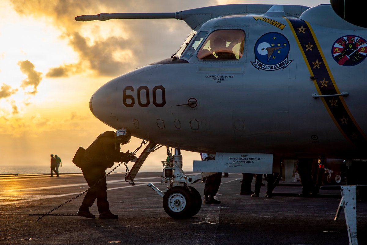An E-2D Advanced Hawkeye prepares to launch from USS Abraham Lincoln during Operation Epic Fury, providing tactical surveillance data.