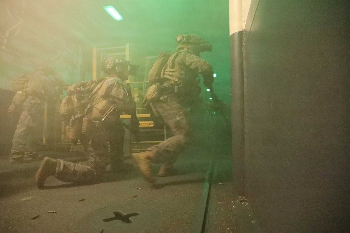 U.S. Marines conduct close-quarters tactics training aboard USS Tripoli (LHA 7) as the amphibious assault ship sails in the Arabian Sea. During training evolutions like these, embarked Marines hone their skills for missions such as maritime interception operations. Tripoli is currently executing a mission to blockade ships entering and departing Iranian ports. The blockade is being enforced impartially against vessels of all nations.