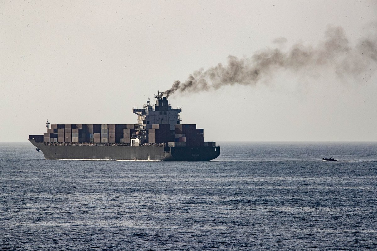 U.S. forces patrol the Arabian Sea near M/V Touska, April 20, as the Iranian-flagged vessel's container cargo is searched after U.S. Marines boarded and seized the ship when it attempted to violate the U.S. naval blockade.