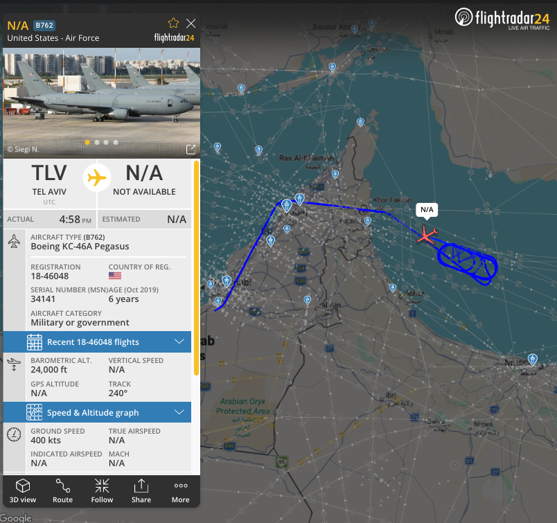 A USAF tanker (AE5F9B, 18-46048) is conducting an air-to-air refueling mission over the Gulf of Oman.