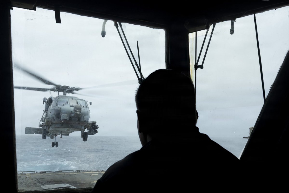 An MH-60 Sea Hawk helicopter lifts off from the flight deck of USS Delbert D. Black (DDG 119) as the ship transits the Arabian Sea in support of the blockade against Iran. As of June 13, CENTCOM forces have redirected 141 commercial vessels and disabled 9 to ensure compliance.