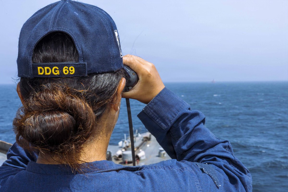 A U.S Sailor aboard USS Milius (DDG 69) stands watch as the guided-missile destroyer transits regional waters supporting the U.S. blockade against Iran. As of June 14, CENTCOM forces have redirected 142 commercial ships that complied and disabled 9 vessels that did not comply.