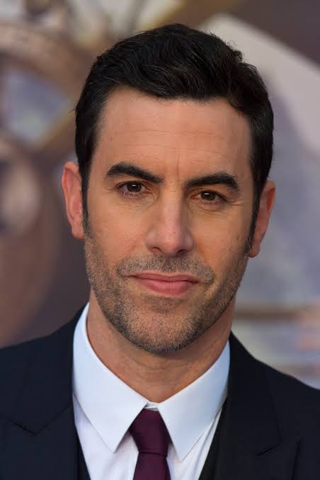 A satirical tweet jokes that Sasha Cohen, the 'former president of Kazakhstan,' has been invited to the funeral of Iran's Supreme Leader, referencing actor Sacha Baron Cohen's Borat character and his Jewish background.