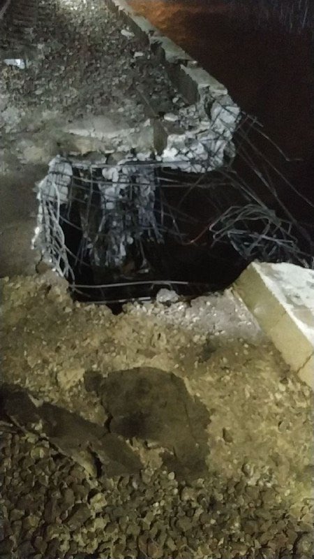 A railway bridge near Aqqala in Iran's Golestan province was destroyed, leaving a large crater and severed rails; the cause and any casualties remain unconfirmed.