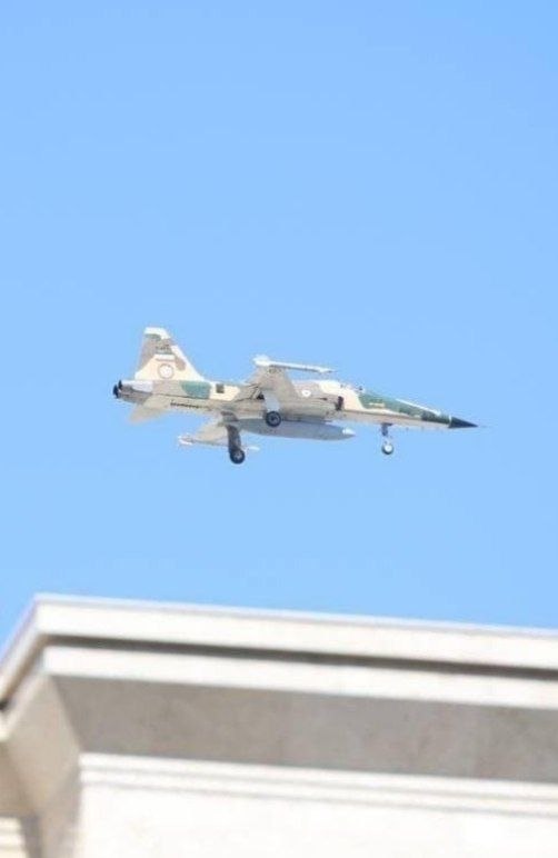 An IRIAF F-5 fighter jet was observed over Mashhad, with landing gear and angle of attack indicating it was landing.