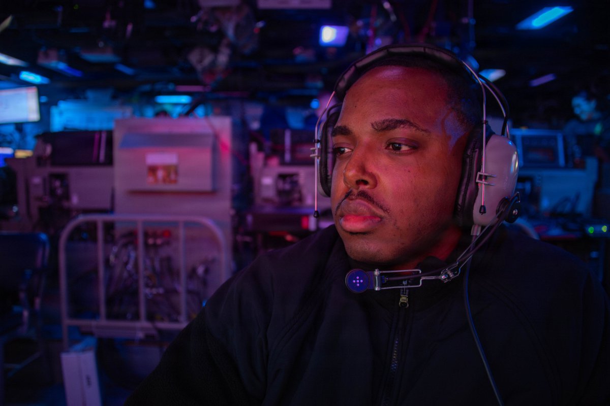 A U.S. Sailor stands watch in the combat information center aboard USS Boxer (LHD 4) as…