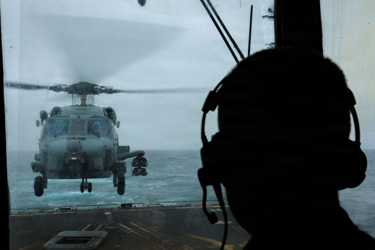 A U.S. Sailor monitors flight operations aboard USS John Finn (DDG 113) as the guided-missile destroyer sails in the Arabian Sea and enforces the U.S. blockade against Iran. As of Aug. 23, U.S. forces have redirected 70 commercial vessels, disabled 3 and boarded 2 to ensure