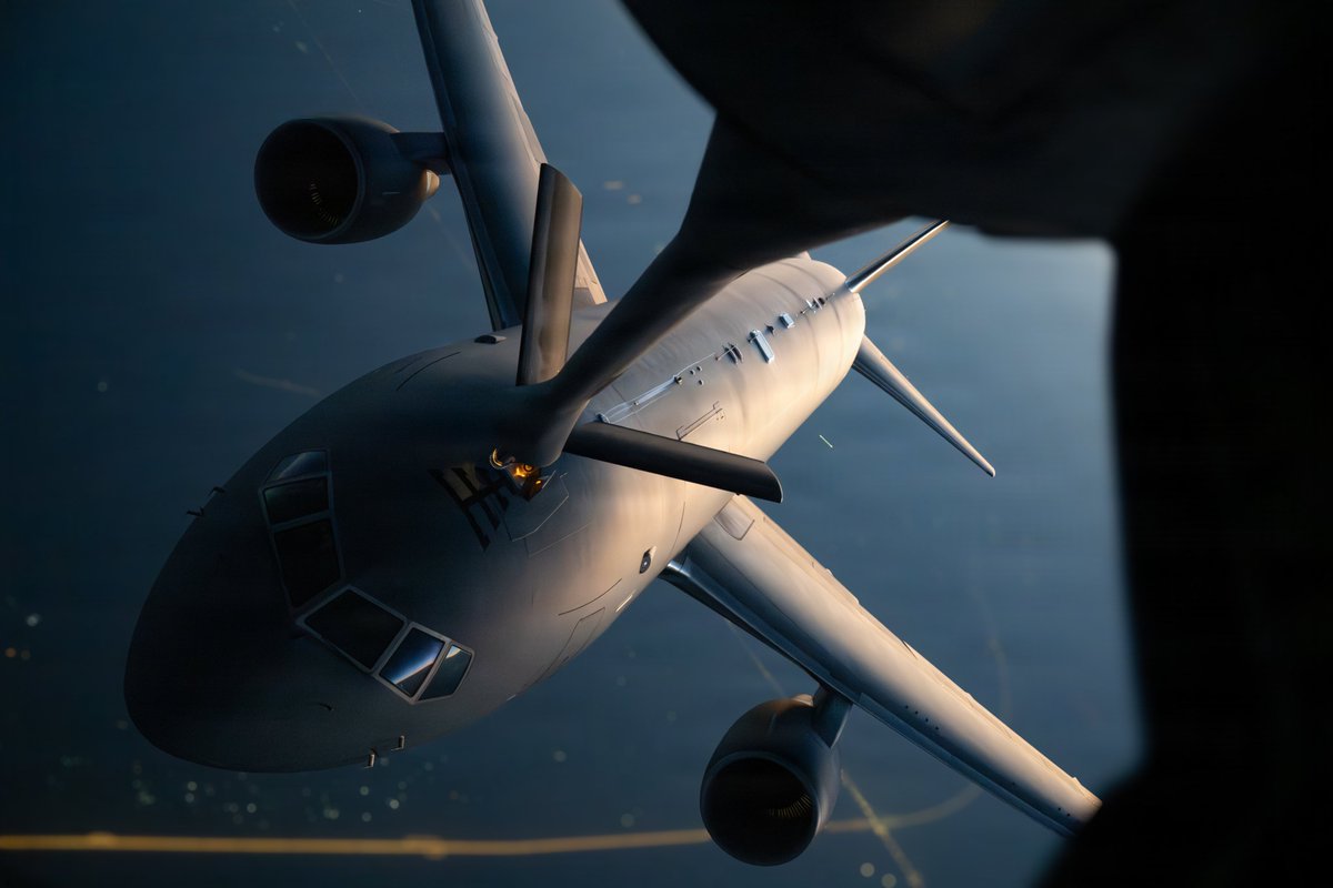A U.S. Air Force KC-46 Pegasus receives fuel from a U.S. Air Force KC-135 Stratotanker while flying over the Middle East.