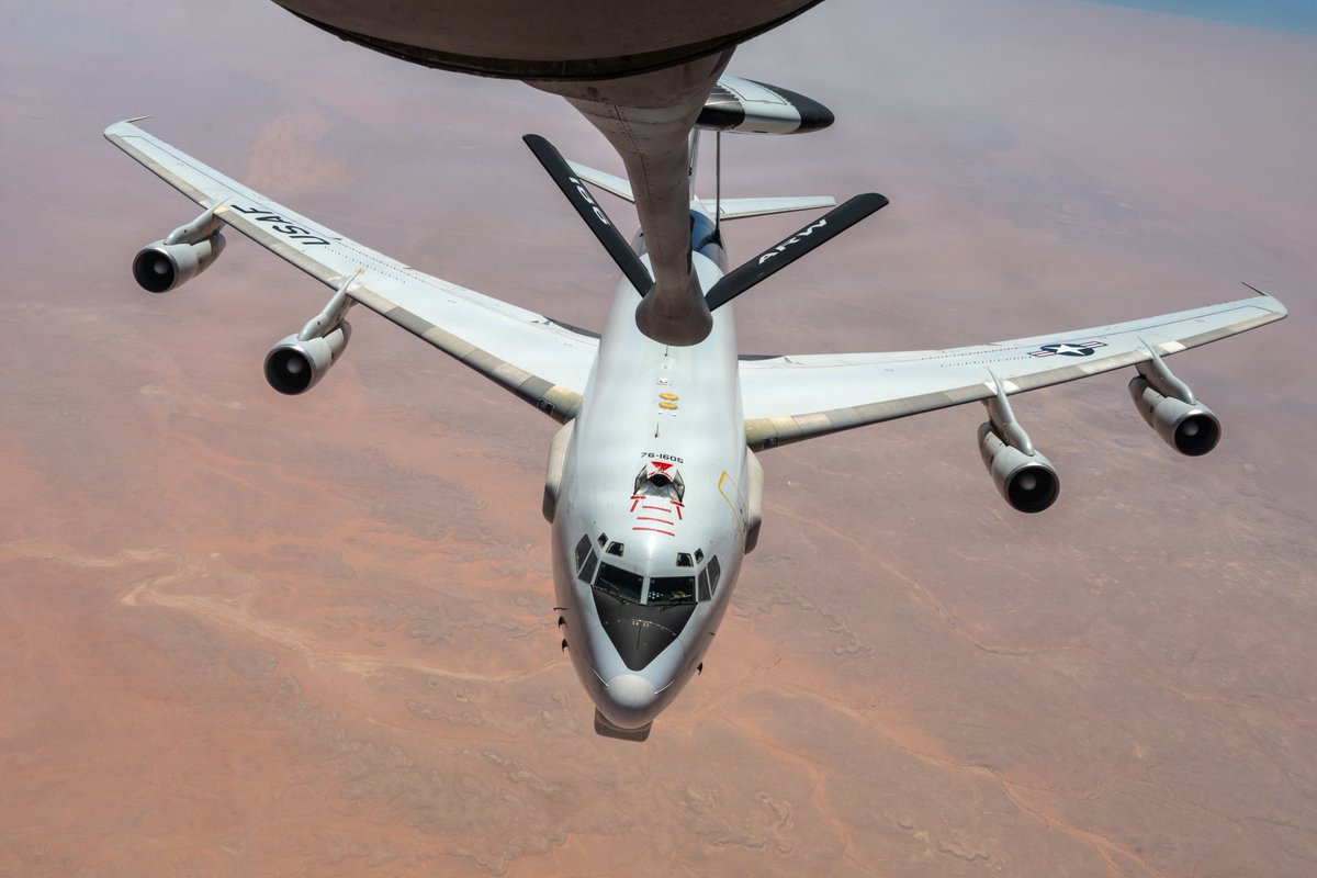A U.S. Air Force E-3 Sentry airborne early warning and control aircraft is refueled by a KC-135 Stratotanker over the Middle East. The E-3 can coordinate with air and ground forces over a large area.